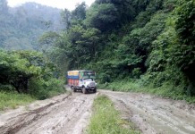 Oil tankers to reach State capital today, bring respite to fuel scarcity A truck trying to manoeuvre through the muddy Imp-Jiribam Highway stretch at Makru.