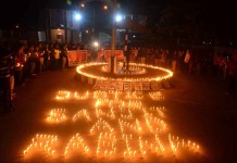 Meet pleads UN to probe BT Road case Students of Manipur University under the aegis of NEFIS taking out a candle light vigil up to the university main gate.